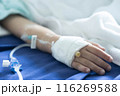 Asian todler in hospital with intravenous saline. Sick children, infected with the virus, are lying and being treated in beds in hospitals. 116269588