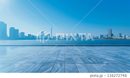近代的な高層ビルが立ち並ぶ都会のウォーターフロント、澄み切った青空、平和で内省的なムード。	 116272748