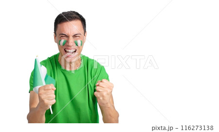 Man cheering for Nigeria screaming and waving a national flag 116273138