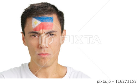 Serious man with a philippine flag painted on the face 116273155