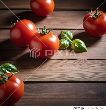 Red tomato on wooden table, highlighted from the window. Play of light and shadow. top view 116276187