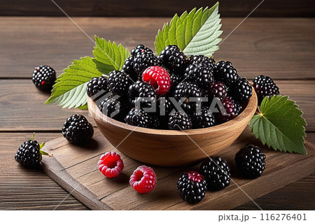 Fresh blackberries on wooden table, blackberries with sunlight, sweet berry on wood background. 116276401