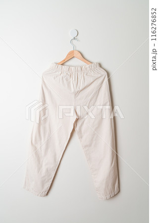 trousers or long pants hanging on wall trousers or long pants hanging on wall 116276852