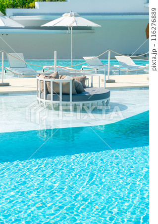 umbrella with bed pool around swimming pool 116276889