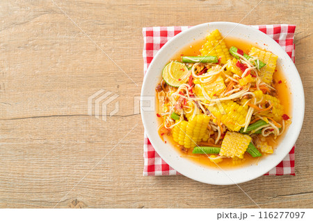 Som Tum - Thai spicy papaya salad with corn 116277097