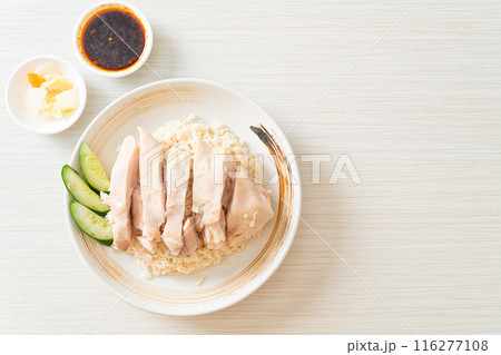 Hainanese chicken rice or rice steamed with chicken soup 116277108