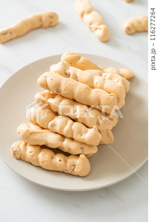 almonds meringue stick on plate 116277264