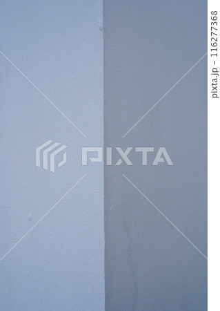 Corner, blue walls, plaster, shadow and light, vertical photo, shades of blue and grey, corner reversal, copy space, right angle. Corner, blue walls, plaster, shadow and light, vertical photo, shades of blue and grey, corner reversal, copy space, right angle. 116277368