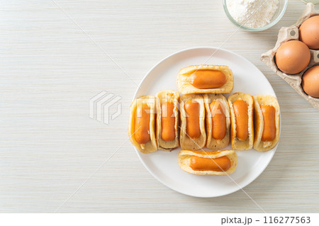 flat pancake roll with sausage 116277563