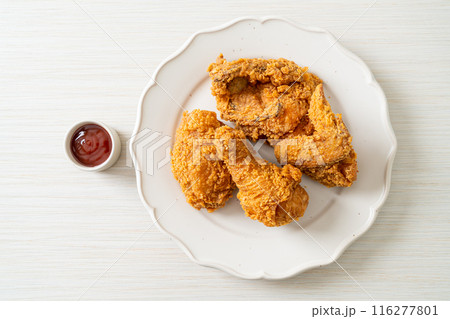 fried chicken with ketchup on plate fried chicken with ketchup on plate 116277801
