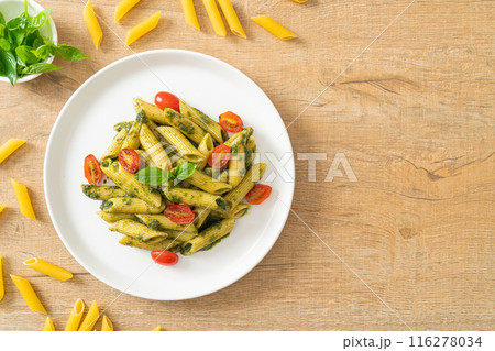penne pasta with pesto sauce and tomatoes penne pasta with pesto sauce and tomatoes 116278034