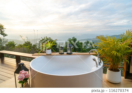 outdoor bath tub with beautiful mountain view background 116278374