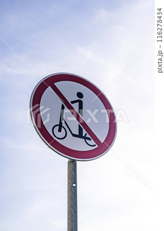 Scooter ban. Sign prohibiting movement on a scooter on a city street Scooter ban. Sign prohibiting movement on a scooter on a city street 116278434