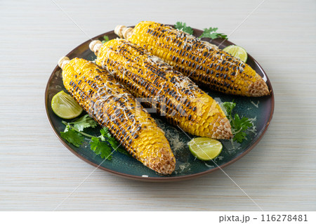 barbecue and grilled corn with cheese and lime 116278481
