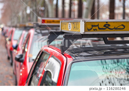 Row of red Petit Taxi in Fez 116280246