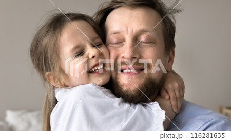 Beautiful little 3s daughter cuddling tightly her young dad Beautiful little 3s daughter cuddling tightly her young dad 116281635