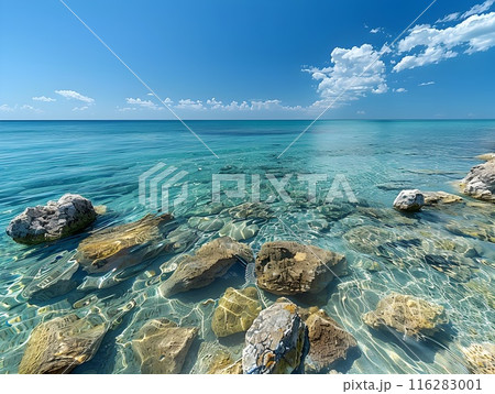 Crystal Clear Turquoise Waters with Rocky Coastline and Cloudless Sky Crystal Clear Turquoise Waters with Rocky Coastline and Cloudless Sky 116283001