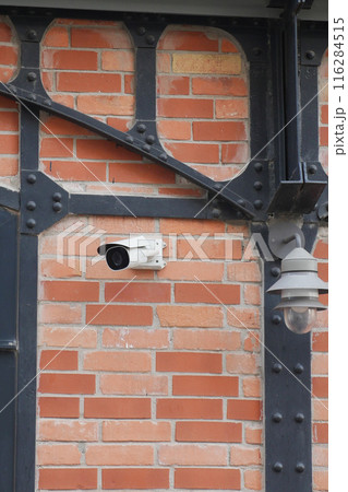 CCTV security camera operating outdoor  116284515