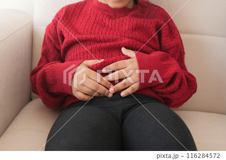 child suffering stomach pain close up. 116284572