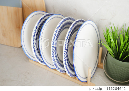 round bowl or ceramic plate on kitchen table. round bowl or ceramic plate on kitchen table. 116284642