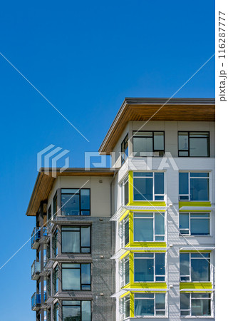 Corners of brand new residential building on blue sky background 116287777