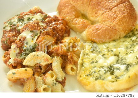 baking crispy butter croissant French bread butter garlic with macaroni dressing fried chop pork and slice tomato in ketchup sauce on plate   116287788