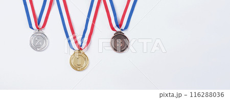 Gold silver and bronze demonstration trophy medals with ribbon for school university or national or olympic sport even organization competition. Isolated on white background. Award and victory concept 116288036