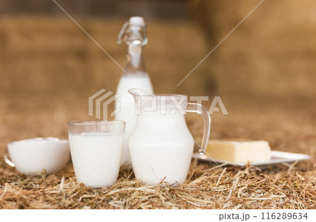 Dairy products on table against the background of hay 116289634