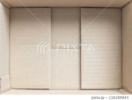 Open empty brown cardboard box background top view 116289843