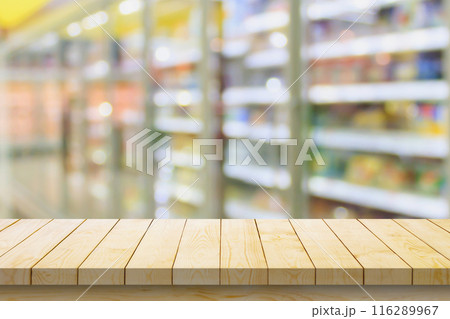 Empty wood table top with supermarket blurred background for product display Empty wood table top with supermarket blurred background for product display 116289967