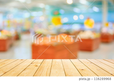 Empty wood table top with supermarket blurred background for product display Empty wood table top with supermarket blurred background for product display 116289968