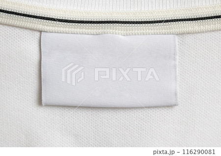 Blank white laundry care clothes label on white shirt fabric texture background 116290081