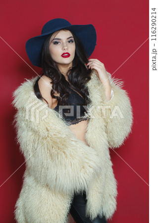 Sexy fashion model woman with long dark wavy hairstyle and red lips make-up Sexy fashion model woman with long dark wavy hairstyle and red lips make-up 116290214
