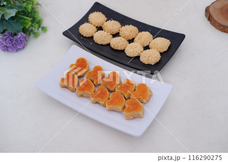 Kue Lebaran is an Assorted Indonesian specialty cookies for Eid al-Fitr or Eid Mubarak. such as Nastar, snow white, kaastengels and thumbprint cookies. Kue Lebaran is an Assorted Indonesian specialty cookies for Eid al-Fitr or Eid Mubarak. such as Nastar, snow white, kaastengels and thumbprint cookies. 116290275