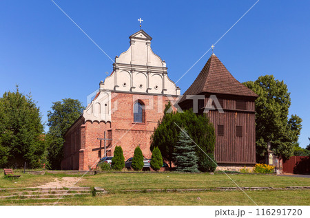 Church of St. Wojciech and wooden bell tower in the city Poznan on a sunny day. Church of St. Wojciech and wooden bell tower in the city Poznan on a sunny day. 116291720