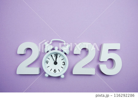 Happy New Year 2025 with alarm clock on purple background 116292286