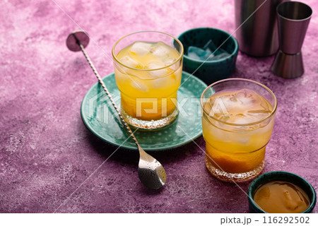 Summer cocktail with mango juice and ice 116292502