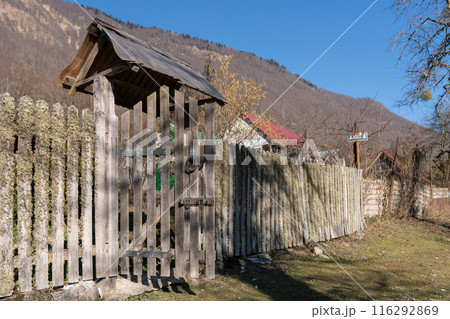 Old fence in a high mountain village in Russia. 116292869