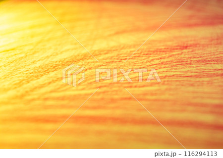 Paper texture with embossed strokes of yellow and orange colors. Paper texture with embossed strokes of yellow and orange colors. 116294113