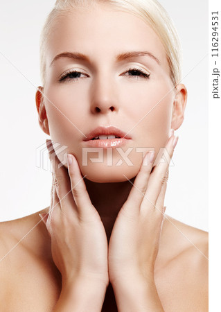 Portrait, skincare and woman with beauty for wellness, facial glow and salon or spa aesthetic in studio. Dermatology, model girl and cosmetics with skin health and natural makeup by white background Portrait, skincare and woman with beauty for wellness, facial glow and salon or spa aesthetic in studio. Dermatology, model girl and cosmetics with skin health and natural makeup by white background 116294531