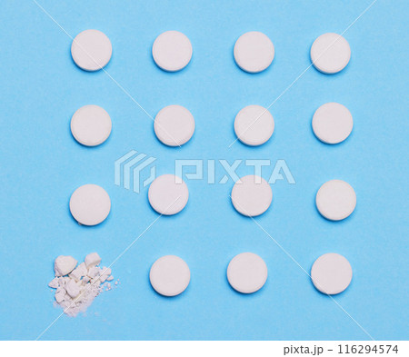 Pills, medication and pharmaceutical in studio with blue background for wellness, health and illness. Medicine, recovery and care for virus, flu or prescription by doctor for patient in hospital 116294574