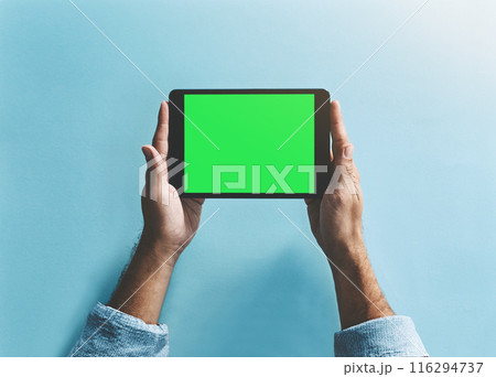 Green screen, tablet and hands in studio with mockup for social media, subscription or sign up service promo. Digital, space and person show online, gaming or web streaming info on blue background 116294737