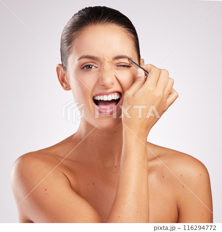Woman, tweezers and eyebrow in studio portrait, treatment and hair removal or epilation on white background. Female person, skincare and tool for maintenance or pain, beauty and cosmetics for shape Woman, tweezers and eyebrow in studio portrait, treatment and hair removal or epilation on white background. Female person, skincare and tool for maintenance or pain, beauty and cosmetics for shape 116294772