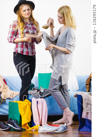 Two female friends after shopping Two female friends after shopping 116295179