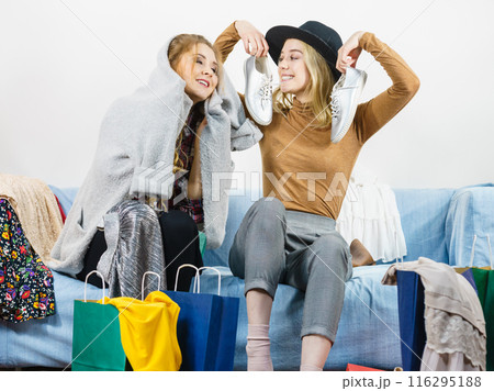Two happy female friends after shopping Two happy female friends after shopping 116295188