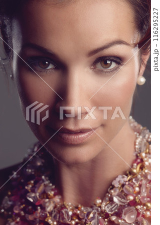 Woman, portrait and elegant or cosmetics in studio, necklace and glow or beauty. Female person, foundation and dermatology for aesthetic or antiaging skincare, facial treatment and grey background Woman, portrait and elegant or cosmetics in studio, necklace and glow or beauty. Female person, foundation and dermatology for aesthetic or antiaging skincare, facial treatment and grey background 116295227