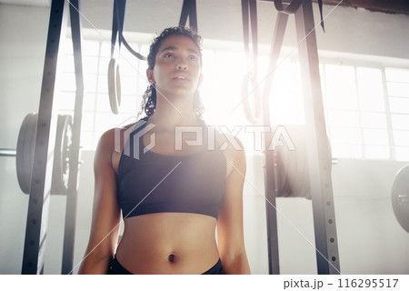 Serious, woman and fitness with weights at gym for workout, exercise or determination in training. Active or young female person or bodybuilder with slim body in sportswear for health and wellness Serious, woman and fitness with weights at gym for workout, exercise or determination in training. Active or young female person or bodybuilder with slim body in sportswear for health and wellness 116295517