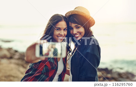 Selfie, screen and women at beach happy for summer holiday, vacation and bonding on weekend. Friends, travel and people with cellphone for photo on social media, online post and profile picture Selfie, screen and women at beach happy for summer holiday, vacation and bonding on weekend. Friends, travel and people with cellphone for photo on social media, online post and profile picture 116295760