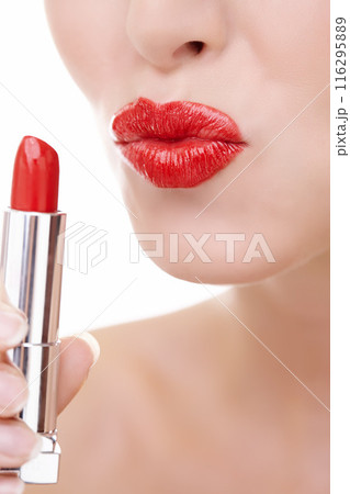 Woman, pout and mouth for red lipstick in studio, makeup and cosmetics for care on white background. Female person, skincare and silver tube, beauty and application of gloss or skin treatment 116295889