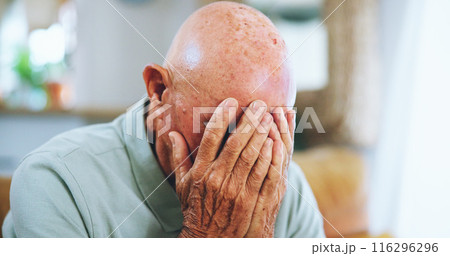 Senior man, sad and crying in home with depression, lost and stress with memory in living room. Elderly person, grief and pain with dementia, perspective and regret for decision in lounge at house 116296296